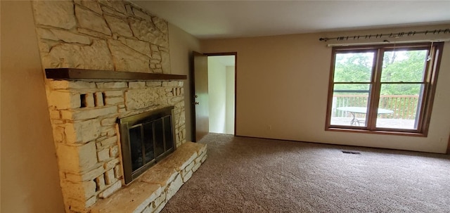 8 Mindy Ln, Bella Vista, AR 72715 - unfurnished living room featuring a fireplace and carpet