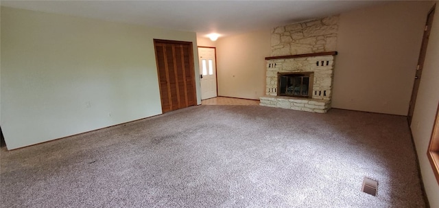 8 Mindy Ln, Bella Vista, AR 72715 - unfurnished living room featuring carpet flooring and a stone fireplace
