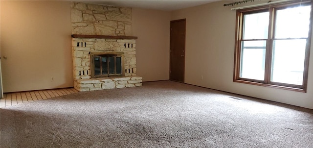 8 Mindy Ln, Bella Vista, AR 72715 - unfurnished living room with carpet flooring and a stone fireplace