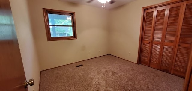 8 Mindy Ln, Bella Vista, AR 72715 - unfurnished bedroom featuring carpet floors and a closet