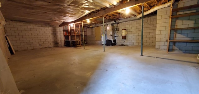 8 Mindy Ln, Bella Vista, AR 72715 - unfinished basement featuring water heater, concrete block wall, and a central vacuum unit