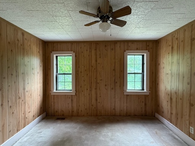 308 Flickinger St, Sulphur Springs, AR 72768 - empty room with healthy amount of natural light, carpet floors, a ceiling fan, and baseboards