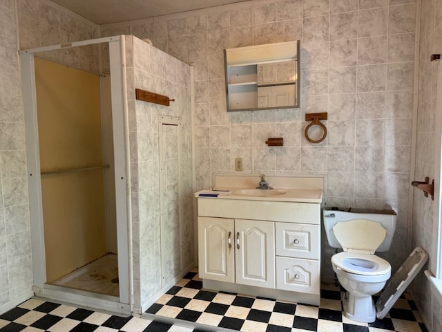 308 Flickinger St, Sulphur Springs, AR 72768 - full bath featuring tile patterned floors, a shower stall, tile walls, vanity, and toilet