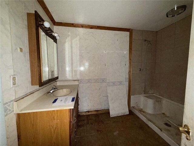 308 Flickinger St, Sulphur Springs, AR 72768 - full bathroom featuring a shower, vanity, tile walls, and tile patterned flooring