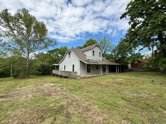 308 Flickinger St, Sulphur Springs, AR 72768 - rear view of property featuring a lawn and roof with shingles