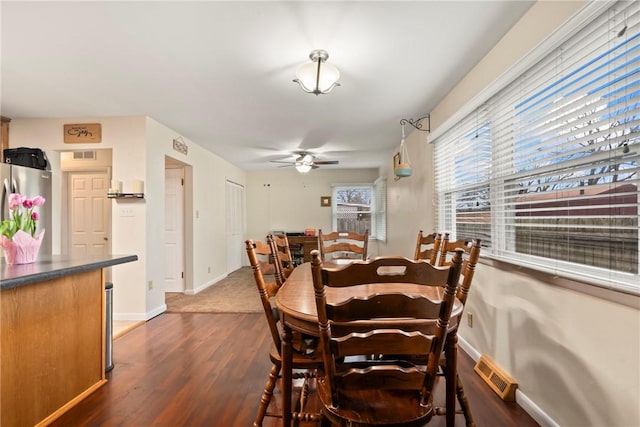 928 S Maple St, Siloam Springs, AR 72761 - dining room featuring dark wood-style floors, ceiling fan, and baseboards