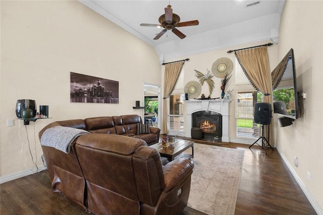 4005 Lyndale Dr, Rogers, AR 72758 - living area with ceiling fan, baseboards, wood finished floors, crown molding, and a warm lit fireplace
