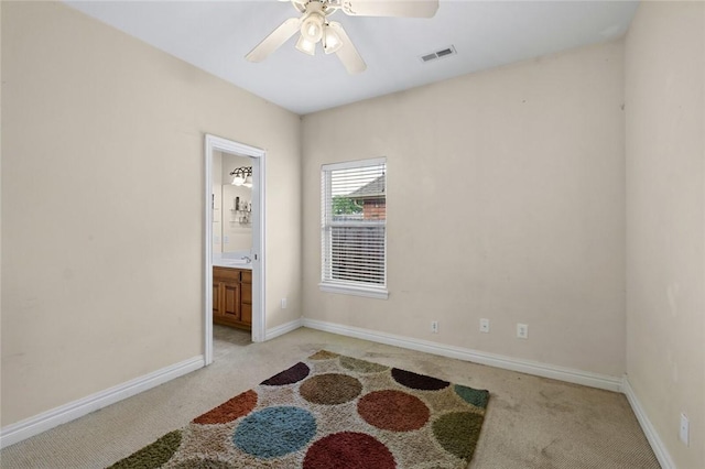 4005 Lyndale Dr, Rogers, AR 72758 - unfurnished room featuring light colored carpet, baseboards, and ceiling fan