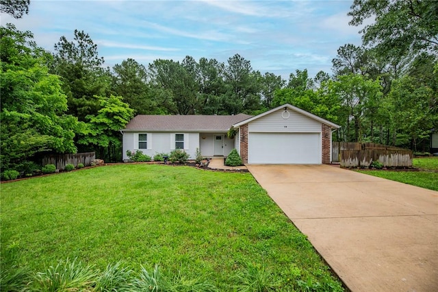 16 Stirling Ln, Bella Vista, AR 72715 - ranch-style house featuring an attached garage, concrete driveway, brick siding, and view of wooded area