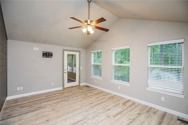 16 Stirling Ln, Bella Vista, AR 72715 - unfurnished room featuring a ceiling fan, wood finished floors, baseboards, and high vaulted ceiling
