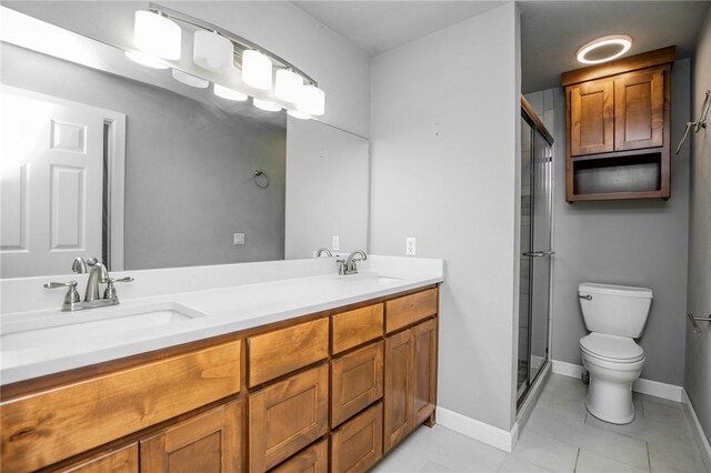 16 Stirling Ln, Bella Vista, AR 72715 - bathroom featuring toilet, double vanity, a shower stall, and tile patterned floors