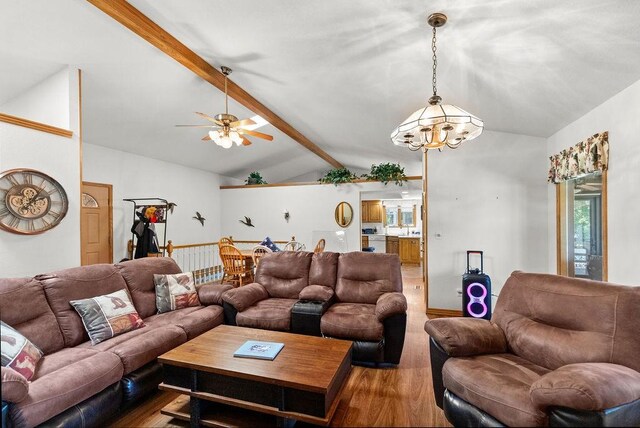 6 Portsmouth Ln, Bella Vista, AR 72715 - living area with wood finished floors, a ceiling fan, and a chandelier