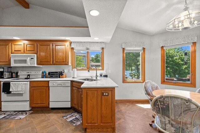 6 Portsmouth Ln, Bella Vista, AR 72715 - kitchen featuring white appliances, a sink, vaulted ceiling, brown cabinetry, and light countertops