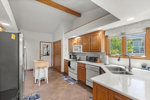 6 Portsmouth Ln, Bella Vista, AR 72715 - kitchen featuring white appliances, a sink, light stone countertops, decorative backsplash, and recessed lighting