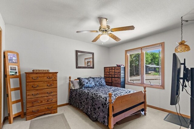 6 Portsmouth Ln, Bella Vista, AR 72715 - bedroom with baseboards, light colored carpet, and a ceiling fan