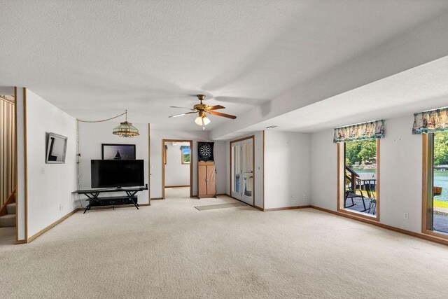 6 Portsmouth Ln, Bella Vista, AR 72715 - living area featuring light colored carpet, baseboards, and ceiling fan