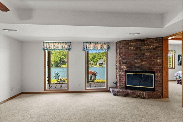 6 Portsmouth Ln, Bella Vista, AR 72715 - unfurnished living room featuring carpet flooring, a fireplace, and baseboards