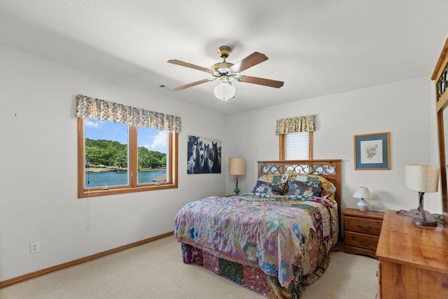 6 Portsmouth Ln, Bella Vista, AR 72715 - carpeted bedroom featuring multiple windows, baseboards, and a ceiling fan