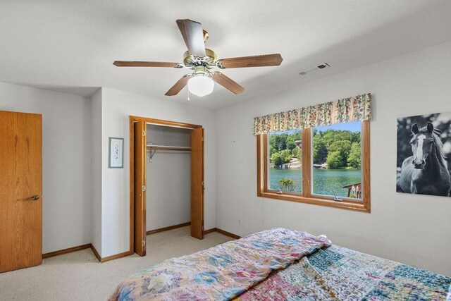 6 Portsmouth Ln, Bella Vista, AR 72715 - bedroom with a closet, baseboards, carpet flooring, and a ceiling fan