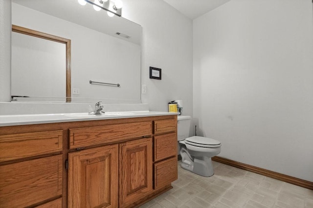 6 Portsmouth Ln, Bella Vista, AR 72715 - bathroom with toilet, vanity, and baseboards