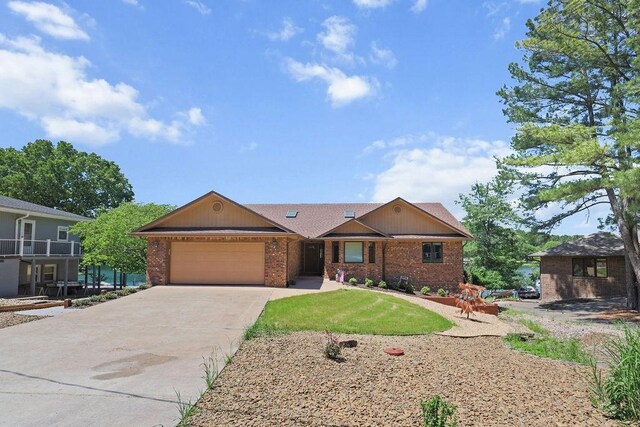 6 Portsmouth Ln, Bella Vista, AR 72715 - ranch-style house with an attached garage, driveway, and brick siding