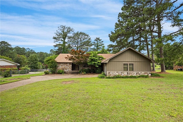 1433 Shalimar Cir, Russellville, AR 72802 - view of front of house with stone siding and dirt driveway