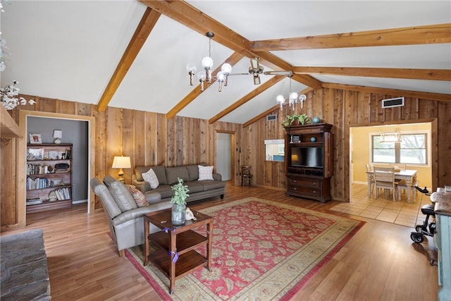 1433 Shalimar Cir, Russellville, AR 72802 - living room featuring a chandelier, wooden walls, and wood finished floors