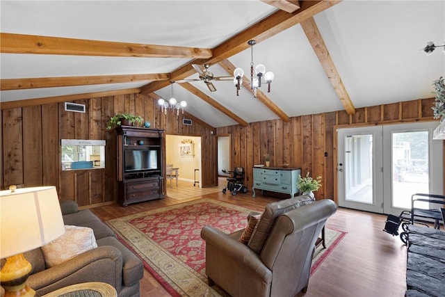 1433 Shalimar Cir, Russellville, AR 72802 - living room with a chandelier, wood walls, and light wood finished floors