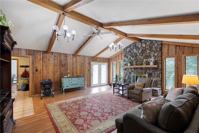 1433 Shalimar Cir, Russellville, AR 72802 - living area featuring a chandelier, healthy amount of natural light, wood finished floors, wood walls, and a ceiling fan
