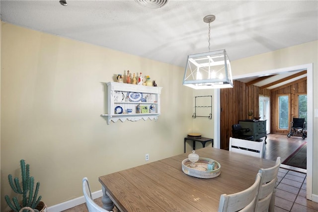1433 Shalimar Cir, Russellville, AR 72802 - dining space featuring vaulted ceiling and wooden walls