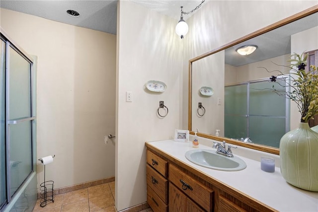 1433 Shalimar Cir, Russellville, AR 72802 - bathroom with vanity, enclosed tub / shower combo, baseboards, and tile patterned floors