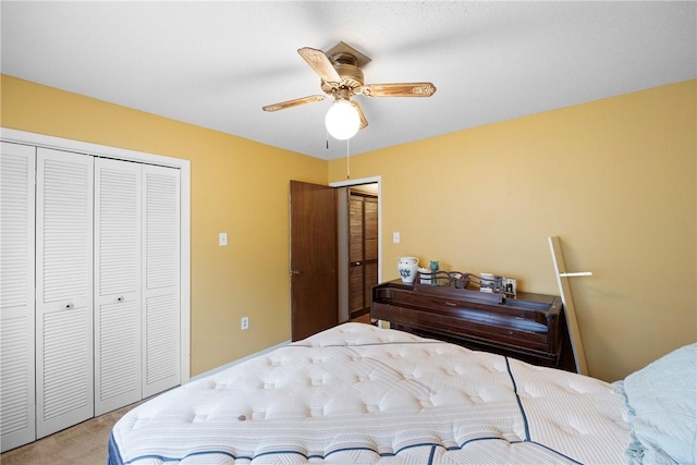 1433 Shalimar Cir, Russellville, AR 72802 - bedroom featuring two closets, a ceiling fan, and light colored carpet