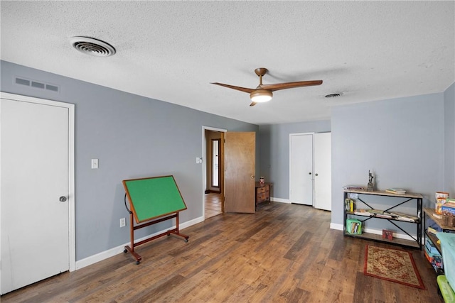 1433 Shalimar Cir, Russellville, AR 72802 - living area with a ceiling fan, wood finished floors, baseboards, and a textured ceiling