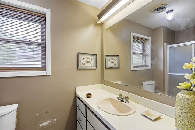 1433 Shalimar Cir, Russellville, AR 72802 - bathroom with toilet, a stall shower, and vanity