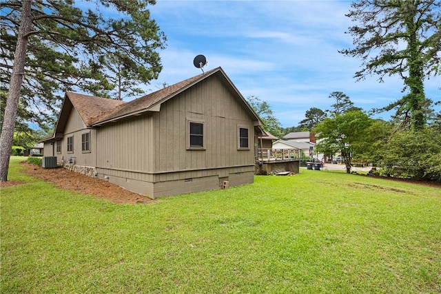 1433 Shalimar Cir, Russellville, AR 72802 - view of property exterior featuring central AC unit, a lawn, a shingled roof, and crawl space