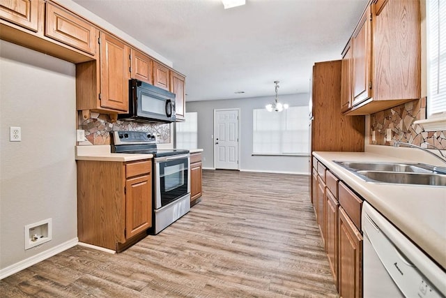 515 Jenkins Rd, Prairie Grove, AR 72753 - kitchen featuring stainless steel electric range oven, black microwave, a sink, dishwasher, and baseboards