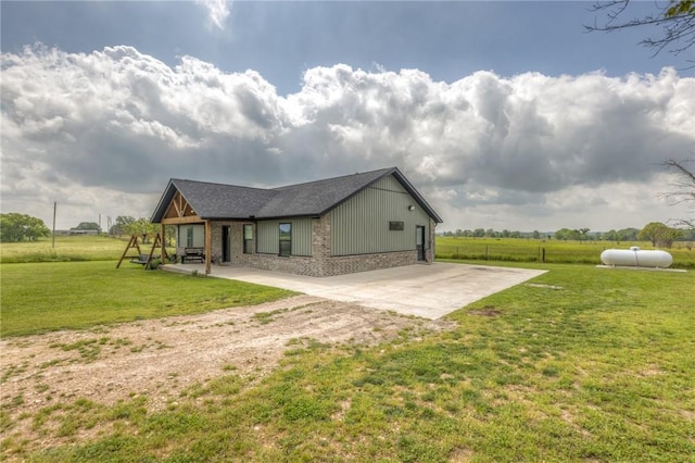 13865 State Highway 116, Colcord, OK 74338 - view of property exterior with a patio and brick siding