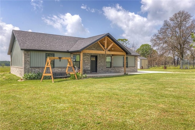 13865 State Highway 116, Colcord, OK 74338 - back of house featuring brick siding, a yard, and roof with shingles