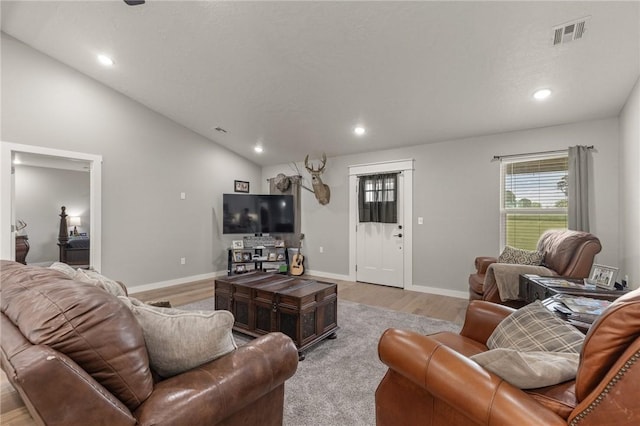 13865 State Highway 116, Colcord, OK 74338 - living area featuring light wood finished floors, healthy amount of natural light, recessed lighting, baseboards, and vaulted ceiling