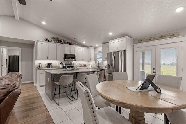 13865 State Highway 116, Colcord, OK 74338 - dining space with lofted ceiling, french doors, recessed lighting, and light wood-type flooring