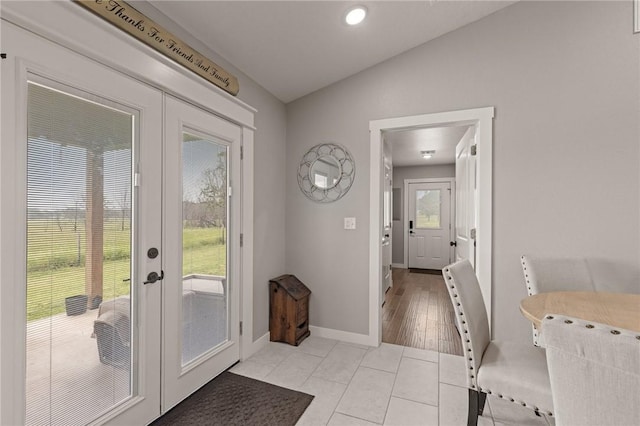 13865 State Highway 116, Colcord, OK 74338 - entryway featuring french doors, healthy amount of natural light, lofted ceiling, light tile patterned floors, and baseboards