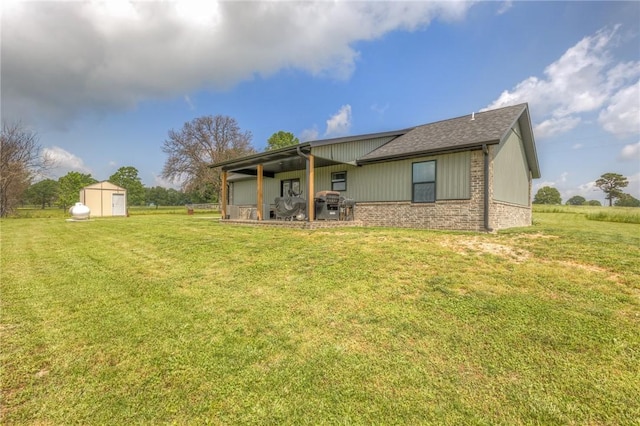 13865 State Highway 116, Colcord, OK 74338 - back of property with a lawn, brick siding, and roof with shingles