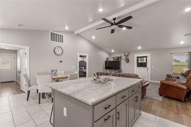 13865 State Highway 116, Colcord, OK 74338 - kitchen with open floor plan, gray cabinetry, a kitchen island, ceiling fan, and recessed lighting