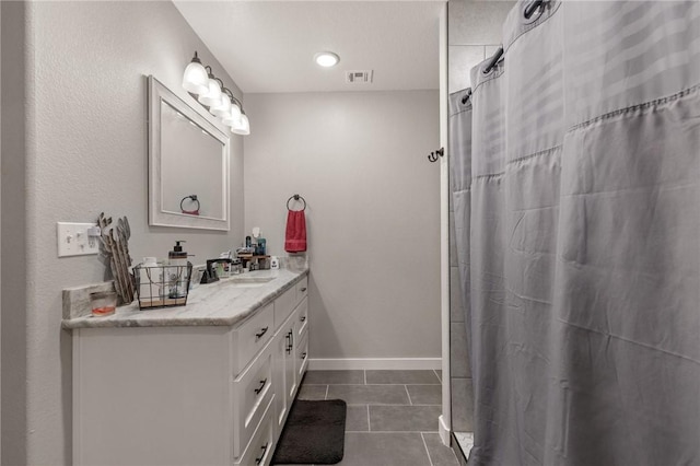 13865 State Highway 116, Colcord, OK 74338 - bathroom with tile patterned floors, vanity, baseboards, and curtained shower