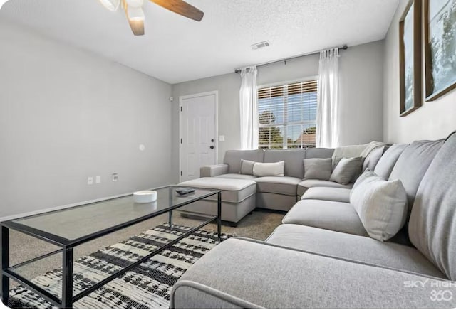 1500 Linwood Cir, Bentonville, AR 72712 - living area featuring ceiling fan and a textured ceiling