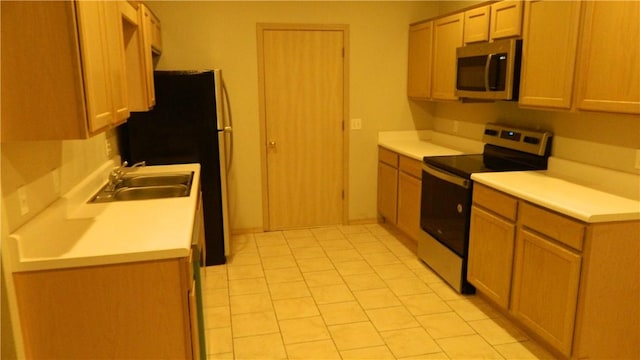 103-105 Dakota Trl, Farmington, AR 72730 - kitchen with stainless steel appliances, a sink, light countertops, and light tile patterned floors