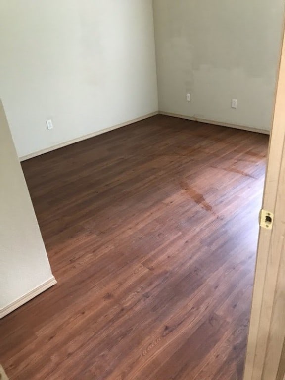 103-105 Dakota Trl, Farmington, AR 72730 - spare room with dark wood-style floors and baseboards