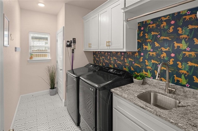 120 Bequette Ln, Centerton, AR 72719 - laundry room featuring separate washer and dryer, cabinet space, and baseboards