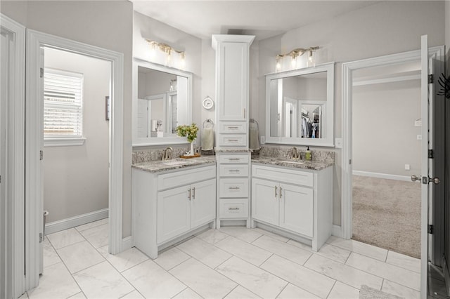 120 Bequette Ln, Centerton, AR 72719 - bathroom with marble finish floors, double vanity, baseboards, and a spacious closet