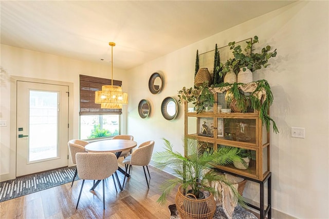 852 Round Top St, Prairie Grove, AR 72753 - dining room featuring a chandelier and wood finished floors